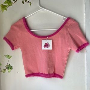 Cute 90s style pink crop top with fuzzy trim